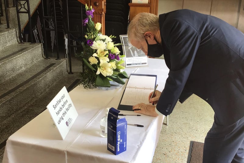 MP Gregory Campbell signing the book of condolences at Coleraine Town Hall