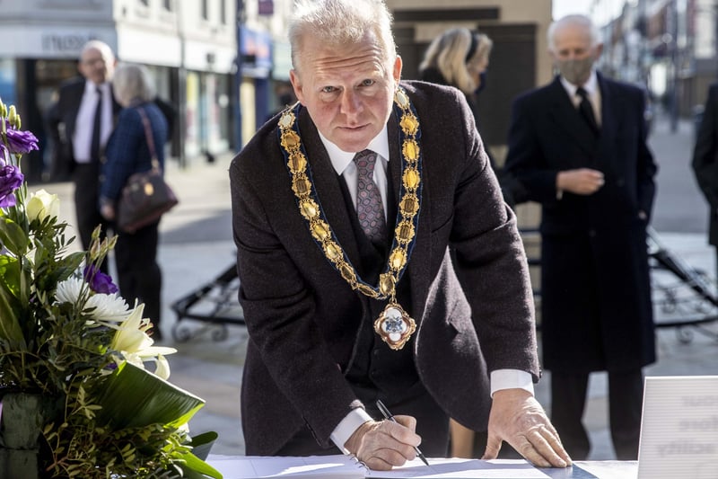 The Deputy Mayor of Causeway Coast and Glens Borough Council Alderman Tom McKeown leaves his message in the Book of Condolence for His Royal Highness Prince Philip Duke of Edinburgh at Coleraine Town Hall