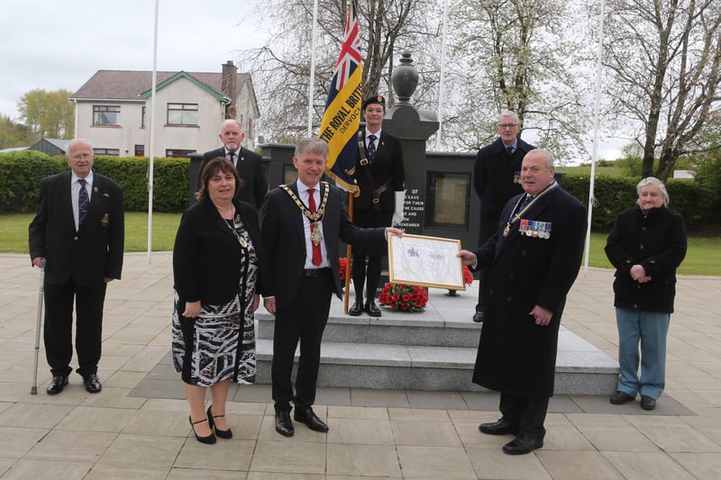Cllr Mark Feilding Mayor of Causeway Coast and Glens Borough Council and his wife Mayoress Phylis presented a plaque to mark the formation of Dervock RBL which celebrated 100 years to George Black Chairman during the laying of a wreath by the Mayor in Dervock at the war memorial to mark VE Day on Saturday. Picture Kevin McAuley/McAuley Multimedia