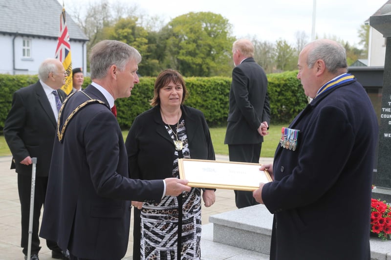Cllr Mark Fielding Mayor of Causeway Coast and Glens Borough Council and his wife Mayoress Phylis presented a plaque to mark the formation of Dervock RBL to George Black Chairman during the laying of a wreath by the Mayor in Dervock at the war memorial to mark VE Day on Saturday