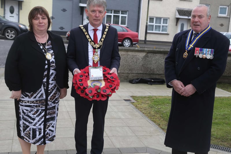 Cllr Mark Fielding Mayor of Causeway Coast and Glens Borough Council with his wife Phylis and George Black Chairman during the laying of a wreath by the Mayor in Dervock at the war memorial to mark VE Dayon Saturday