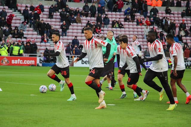 Sunderland AFC players warming up in the shirts