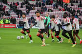 Sunderland AFC players warming up in the shirts