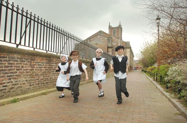 Pupils of Hill View Junior School taking part in a Living History Lesson at the Donnison School