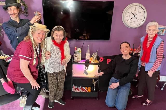 Woven Nest’s Theatre's Poppy Crawshaw, kneeling, Elliot Mann, left and St Mark’s activities co-ordinator Denise Horsburgh, second left, with residents at the workshop