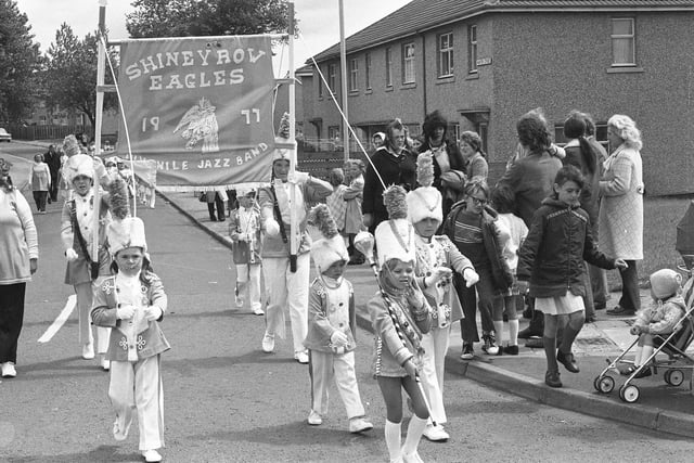 Mascot Tracy Muldown, 5, leads the Shiney Row Eagles Jazz Band to the Grangewood Recreation Ground during the Shiney Row Community Association Carnival in 1977.
