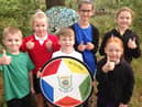 (Left to right) Jenson Hutchinson, five, Skye Bolden, seven, Harrison Winter, six, Lydia Andrews, 10, Skylar Welsh, five and Laycie Shipley, nine, giving a thumbs up to the school's latest good Ofsted judgement.