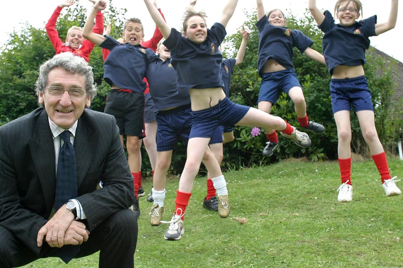Buxton Community school head Alan Kelly celebrates their sucess as a sports college with some of the sporty year 7s