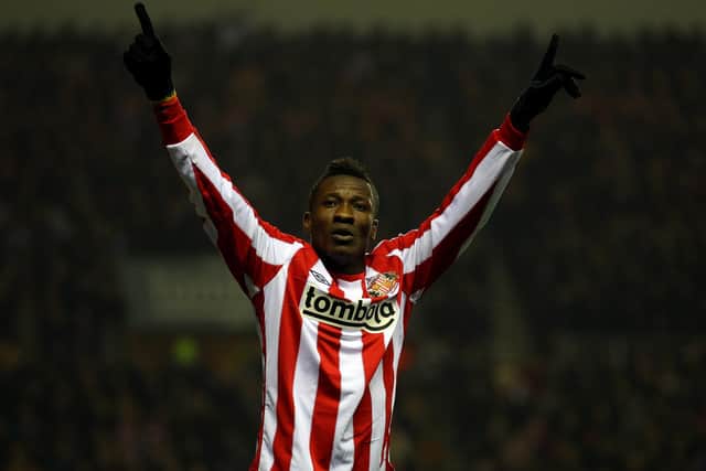 SUNDERLAND, ENGLAND - FEBRUARY 12:  Asamoah Gyan of Sunderland celebrates scoring the first goal during the Barclays Premier League match between Sunderland and Tottenham Hotspur at the Stadium of Light on February 12, 2011 in Sunderland, England.  (Photo by Julian Finney/Getty Images)