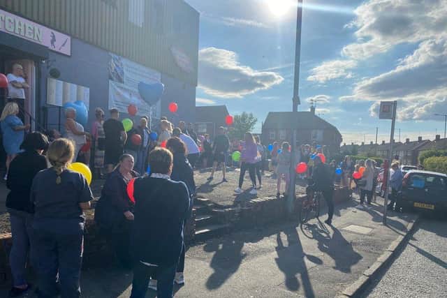 Around 60 people turned out to join in a balloon release, minute's silence and a clap in tribute to Sam Murphy.
