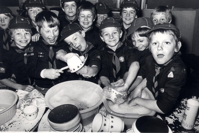 Members of the 74th Sheffield (heeley) cub scouts, buckle down to a sponsered dish washing session at Heeley parish church hall  June 1979
