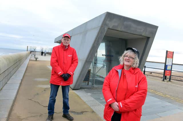 Volunteer tour guides Stuart Robson and Maureen McCartney at the entrance to the tunnel