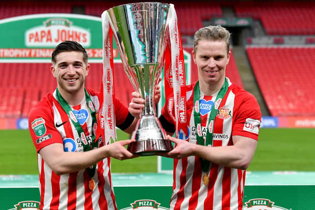 Lynden Gooch and Grant Leadbitter hold the Papa John’s trophy. Picture by FRANK REID