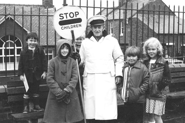 Mr Elliott with pupils from Houghton Infant School on his last day as 'lollipop' man at the school in 1980.