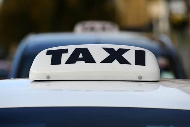 File picture of a taxi sign, after an incident involving a passenger saw him end up in court.