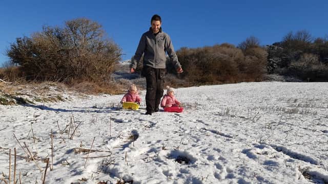 David Bryant with daughters Maddison, one, and three-year-old Ruby. But not everyone is enjoying our extended winter.