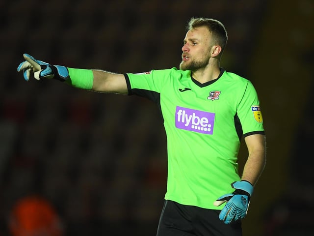 The new signing from Exeter will go straight into the squad and take up deputy goalkeeping duties.