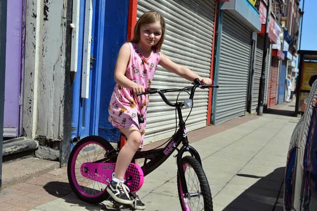 Seven year-old Kasie Williams' new BMX Eclipse is her pride and joy. Picture by Stu Norton