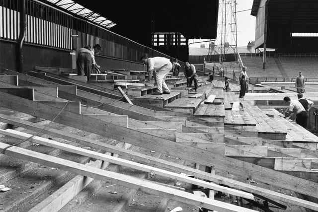 Workmen busy removing the temporary seating put in place at Roker Park for the World Cup, before the new domestic season began.