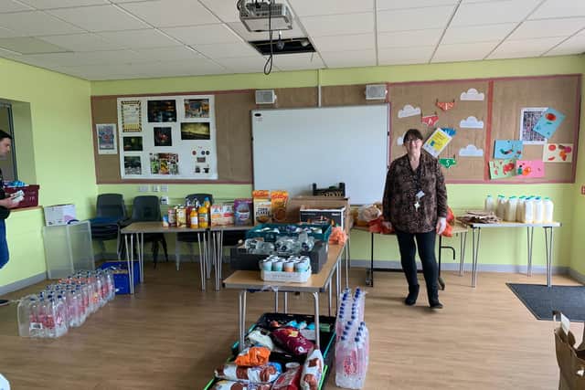Acting deputy head of Hudson Road Primary School Maria MrGrory with items donated to help families.