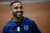 England's forward #24 Callum Wilson takes part in a darts competition against a journalist at Al Wakrah SC Stadium in Al Wakrah, south of Doha on December 8, 2022 during the Qatar 2022 World Cup football tournament. (Photo by Paul ELLIS / AFP) (Photo by PAUL ELLIS/AFP via Getty Images)