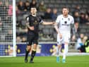 MILTON KEYNES, ENGLAND - APRIL 05: Luke Offord of Crewe Alexandra and Connor Wickham of Milton Keynes Dons look on during the Sky Bet League One match between Milton Keynes Dons and Crewe Alexandra at Stadium mk on April 05, 2022 in Milton Keynes, England. (Photo by Pete Norton/Getty Images)