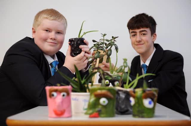 Kepier Academy students David Kane and Toby Hall with plants to be grown in the school grounds.