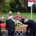 Men were asked to wear suits and people were urged to wear bright colours for the funeral.