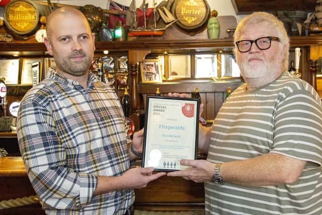 Fitzgerald's manager Matty Downs receives a certificate honouring the pub's 30 years in the Good Beer Guide from Ian Monteith-Preston, chairman of CAMRA's Sunderland and South Tyneside branch. Picture by Michael Gant.