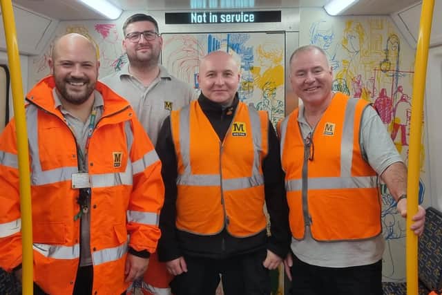 Members of the test team aboard one of the new trains