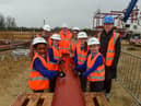 Pupils at Hetton Primary School signing a steel girder to be used in the construction of their new school pictured with l-r Sunderland City Councillor Claire Rowntree, Gary Hope Regional MD Robertson Construction, Sunderland City Councillor Louise Farthing and Headteacher Nicola Hill.