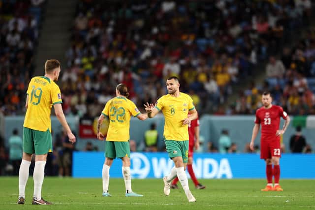 Bailey Wright of Australia talks with teammates during the FIFA World Cup Qatar 2022 Group D match between Australia and Denmark at Al Janoub Stadium.