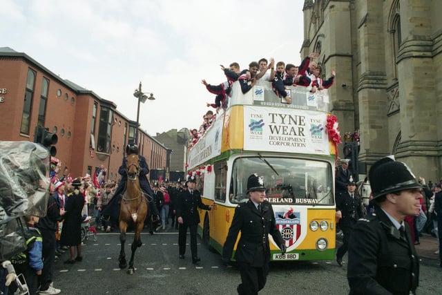 The team - including Sunderland legend Kevin Ball - or on top of the bus.
