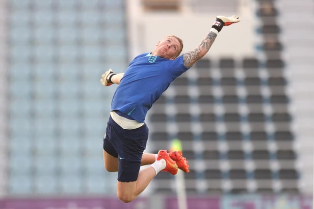 Jordan Pickford makes a save during the England Training Session at at Al Wakrah Stadium. (Photo by Alex Pantling/Getty Images).