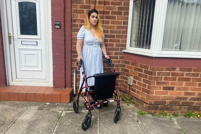 Dominique Glover, 25, needs to use her walker to cover any significant distances.