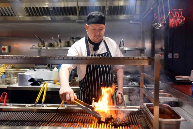 head chef Kieran Fear on the grill
