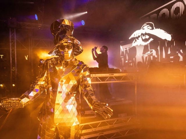An artist dazzles on stage.