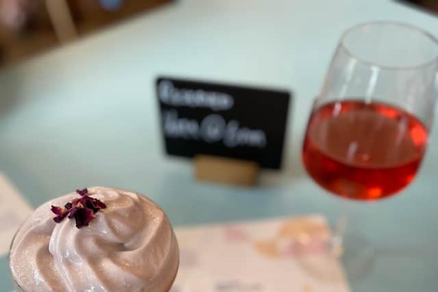 The French Kiss cocktail has a red wine foam