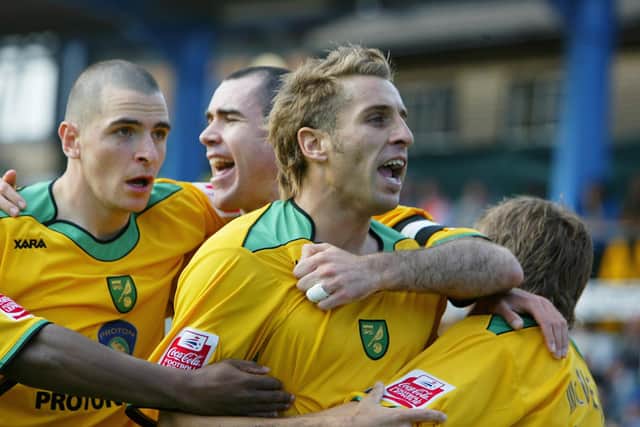 BRIGHTON, UNITED KINGDOM - OCTOBER 01:  Darren Huckerby of Norwich celebrates scoring a goal with team mates during the Coca-Cola Championship match between Brighton & Hove Albion and Norwich City at the Withdean Stadium on October 1, 2005 in Brighton, England.  (Photo by Julian Finney/Getty Images)