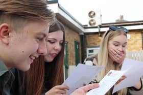 (left to right) Jack Stead, Thea Sloanes and Nieve Howat, all 16, react to seeing their GCSE results.