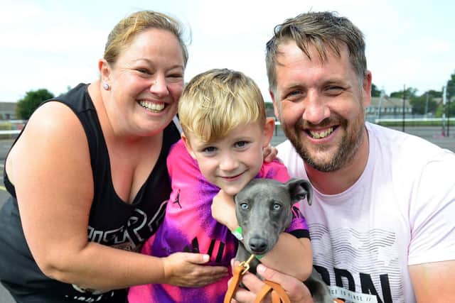 (left to right) Vicki, Seth and Gareth Bray with their dog Ellie are full of smiles at the Summer Bus. Vicki said the initiative was "brilliant" for families.

 Picture by Frank Reid