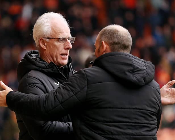 BLACKPOOL, ENGLAND - FEBRUARY 18: Mick McCarthy, Manager of Blackpool, interacts with Alex Neil, Manager of Stoke City, prior to the Sky Bet Championship between Blackpool and Stoke City at Bloomfield Road on February 18, 2023 in Blackpool, England. (Photo by Charlotte Tattersall/Getty Images)