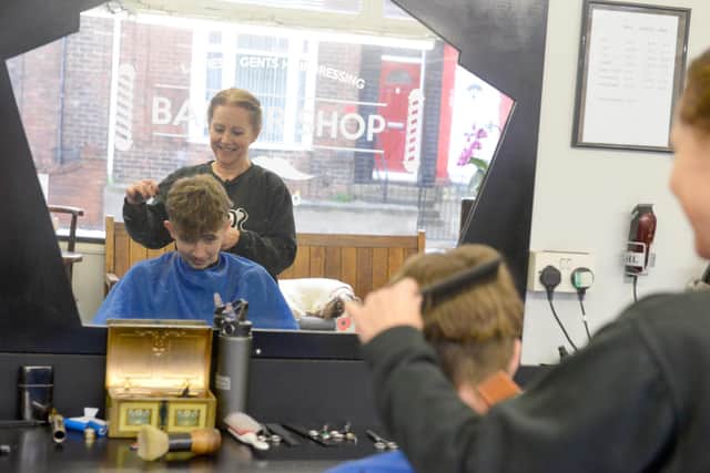 Toby appears to be less happy about the haircut than his mam Naomi. Sunderland Echo image.
