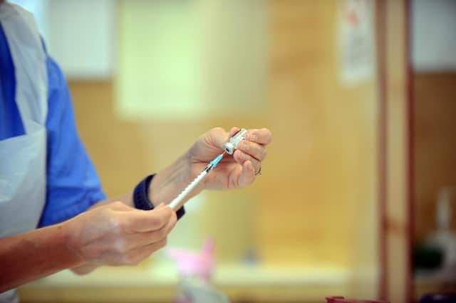A Covid vaccine being prepared.