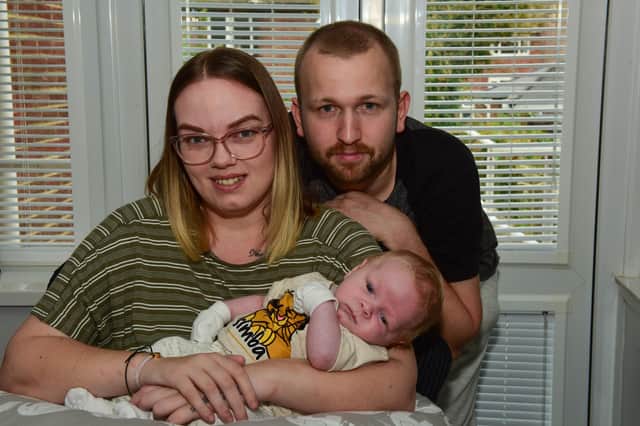 Ashleigh Turner, who had a severe spinal stroke at nine-weeks pregnant, with son 7-week-old Jacob and partner Stephen Joyce