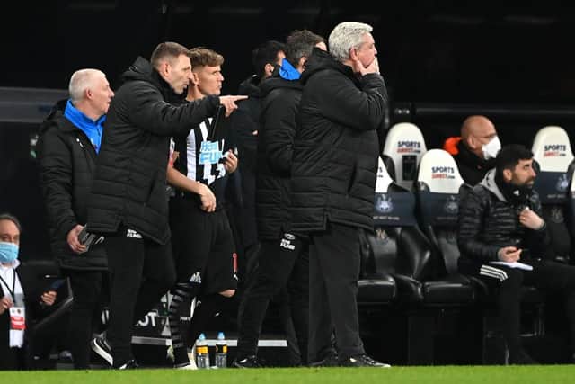 Matt Ritchie is given instructions by Graeme Jones before coming on against Wolverhampton Wanderers as Steve Bruce stands on the touchline.
