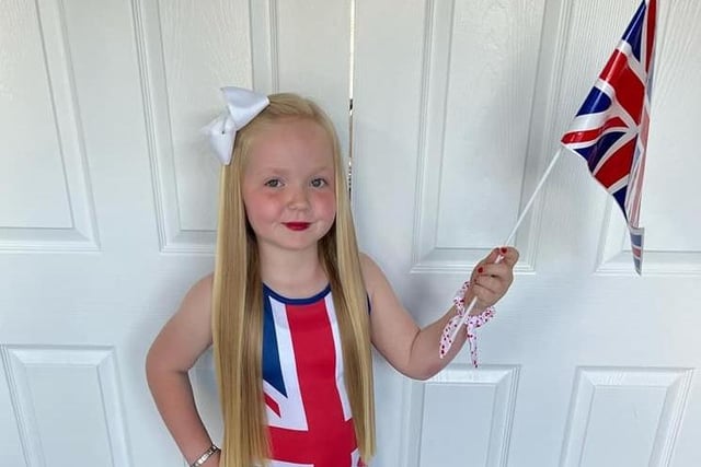 Ruby Bestford, age 6, of Bexhill Academy. A great outfit with a flag to match!