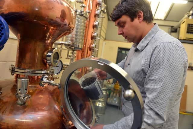 WL Distillery managing director Scott Wilson-Laing starts the process of producing gin.