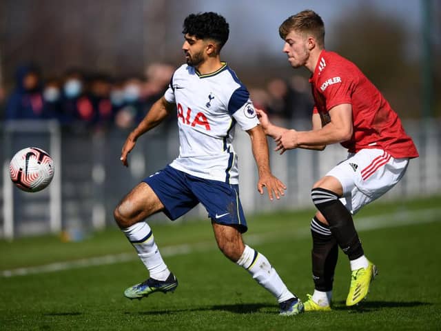 Dilan Markanday of Tottenham Hotspur battles for possession with Ethan Galbraith of Manchester United.