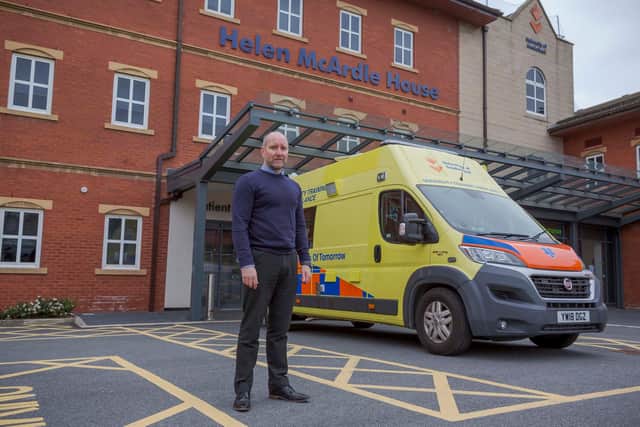Sunderland University's technical operations manager Mark Addison hands over the training ambulance and equipment to representatives NEASUS (North East Ambulance Service Unified Solutions) at Helen McArdle House Picture: David Wood.